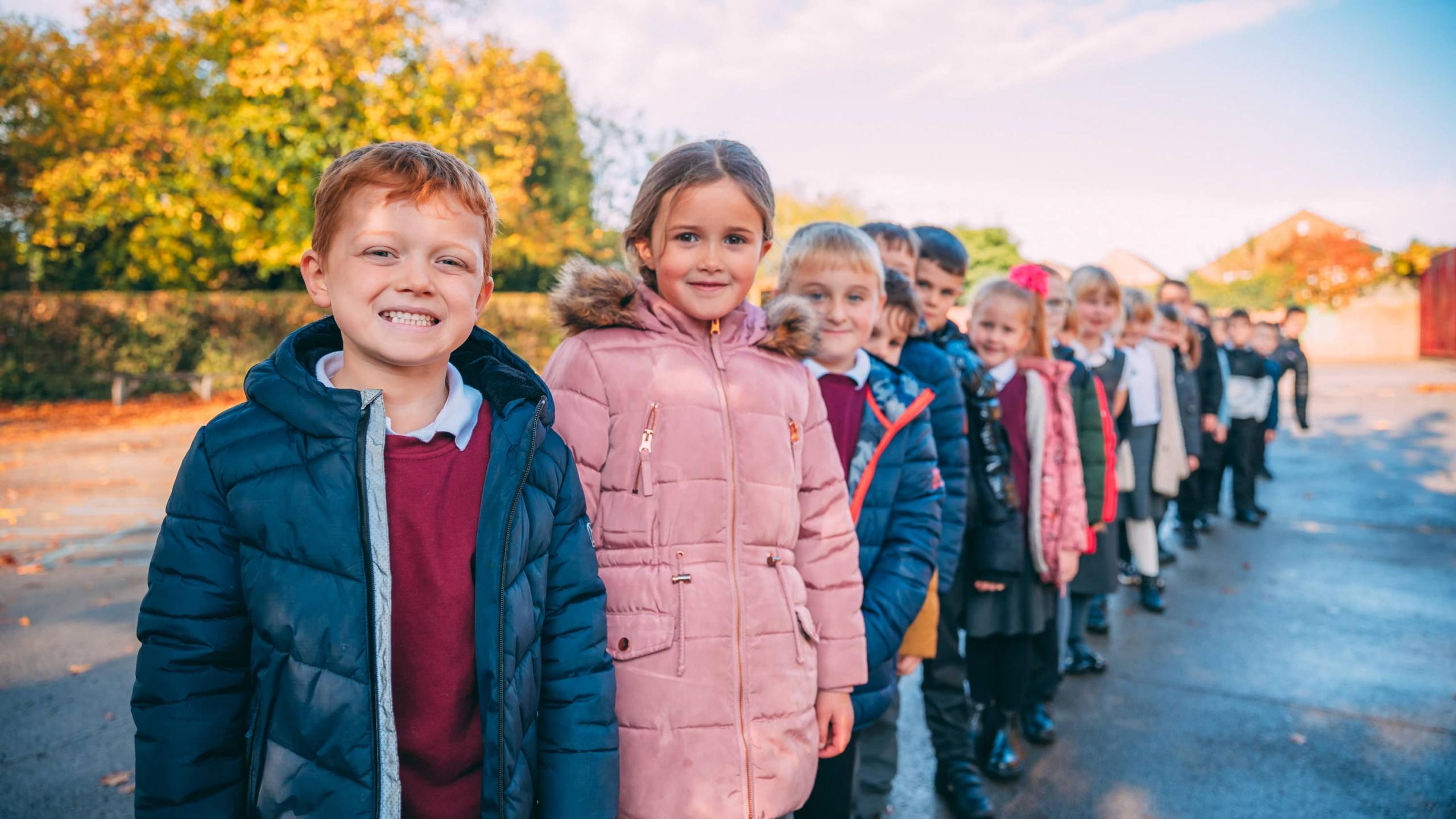 Pupils line up in the playground